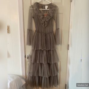 Brown ruffle dress with mesh material.